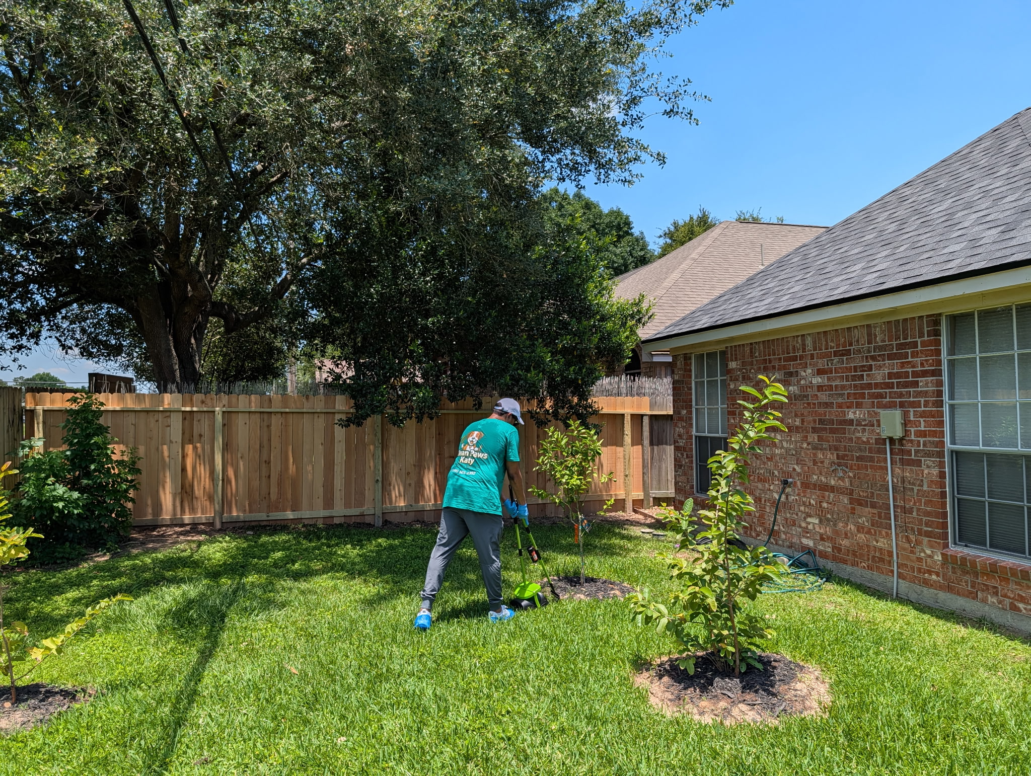 Sam working in a customer's backyard in Katy TX