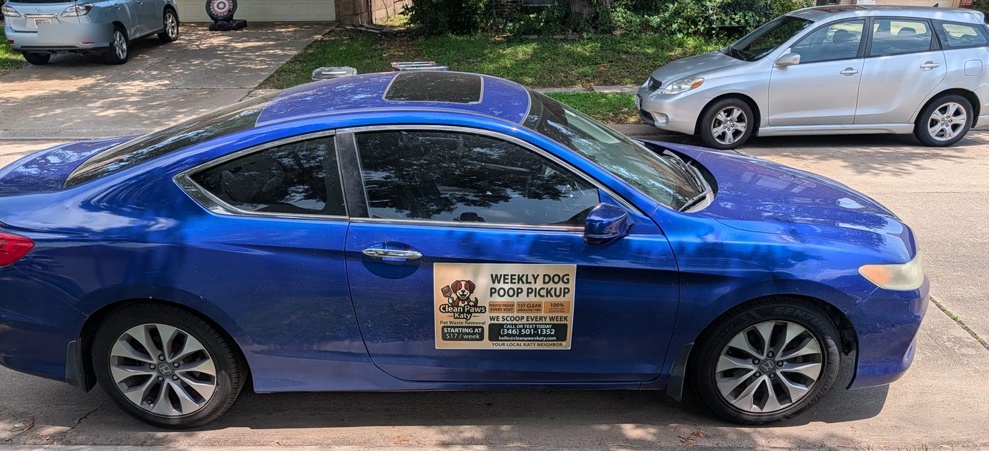 Sam's blue Honda Accord with Clean Paws Katy magnet, parked in a Katy driveway